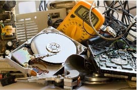 a pile of dated electronics ready for disposal