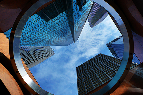 Houston skyscrapers within a circle looking up, representing society and the circular economy